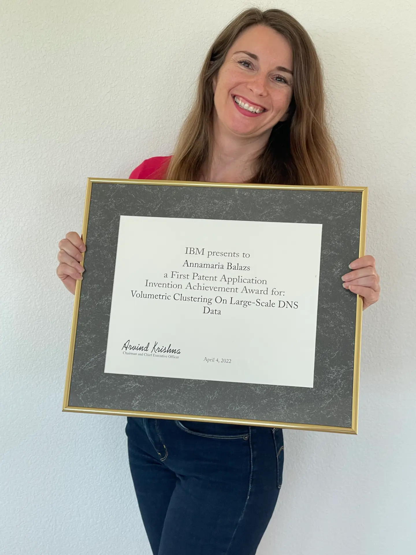 Annamaria Balazs holding her IBM First Patent Application Invention Achievement Award
